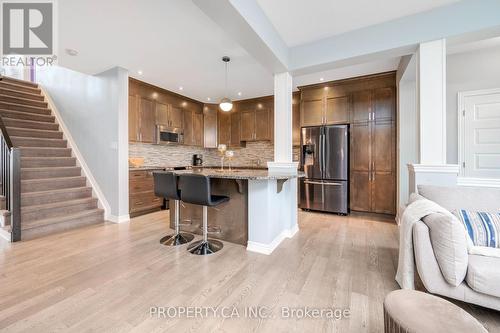 Chef's kitchen flows to living space - 125 Sweetvalley Drive, Ottawa, ON 