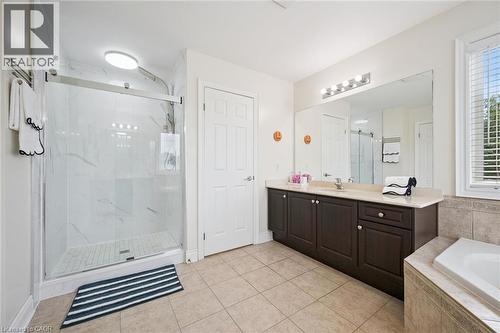 Walk-in shower with clear glass enclosure and tile surround - 517 Topper Woods Crescent, Kitchener, ON 