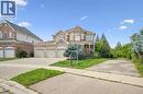 Brick and stone exterior with a multi-car garage - 517 Topper Woods Crescent, Kitchener, ON 