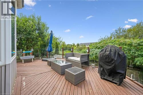 Spacious wood deck with glass panel railings - 517 Topper Woods Crescent, Kitchener, ON 
