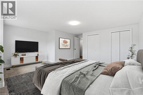 Recessed lighting, light gray wall color, neutral carpet, and two bi-fold closet doors - 30 S Imperial Road Unit# 3, Guelph, ON 