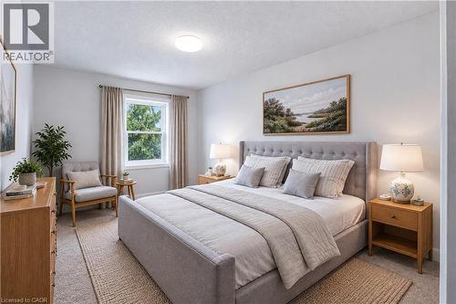 Carpeted flooring, recessed lighting, and a double-hung window with drapery - 30 S Imperial Road Unit# 3, Guelph, ON 