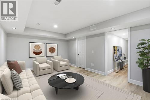 Recessed lighting, wood-finish flooring, white baseboards, solid core interior door, and a wide entryway - 30 S Imperial Road Unit# 3, Guelph, ON 