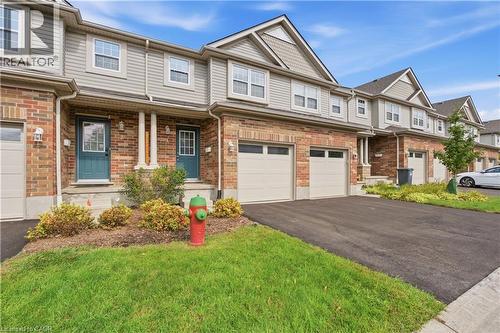 Brick and siding exterior with gabled roof lines - 30 S Imperial Road Unit# 3, Guelph, ON 