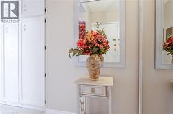 Built-in cabinetry with white panel doors and polished hardware - 