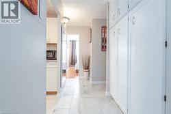 White shaker-style cabinetry with chrome hardware - 