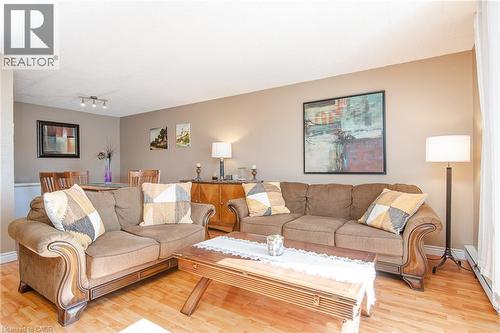 Wood-finish flooring throughout, complemented by neutral wall tones - 71 Vanier Drive Unit# 310, Kitchener, ON 