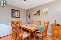 Wood-finish flooring with a textured ceiling and neutral wall paint - 