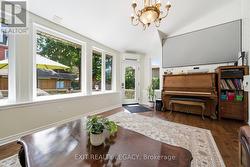 Large sunroom and exit to desk/backyard - 