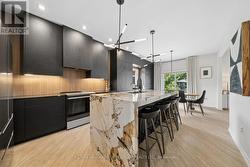 Kitchen w/ Natural Stone Waterfall Counter - 