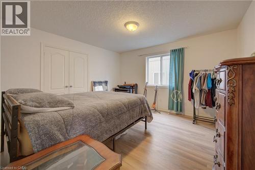 Light wood-finish flooring, double panel doors, and a window for natural illumination - 78 Stuckey Avenue, Baden, ON 