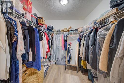 primary bedroom large walk-in closet with light fixture - 78 Stuckey Avenue, Baden, ON 
