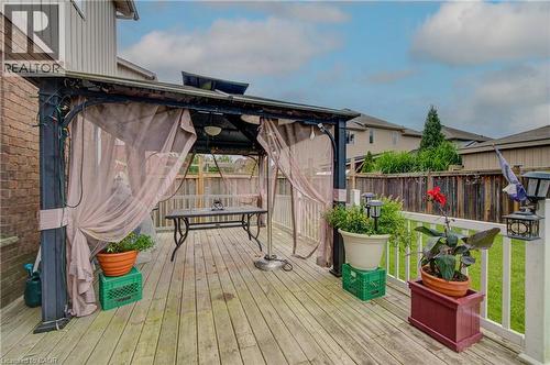 Expansive wood-finish deck with a built-in gazebo and privacy screens - 78 Stuckey Avenue, Baden, ON 