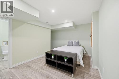 Recessed lighting illuminates wood-finish flooring - 3198 Tim Dobbie Drive, Burlington, ON 