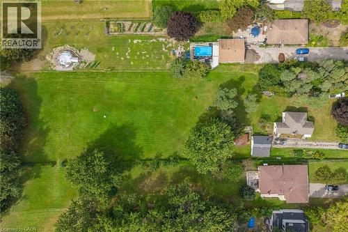 Expansive green spaces with mature trees and established garden beds - 1412 Old York Road, Burlington, ON 
