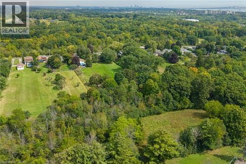 Expansive property featuring verdant mature trees and open grassy areas - 1412 Old York Road, Burlington, ON 