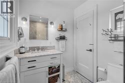White vanity with stone countertop and integrated sink - 