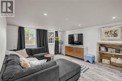 Recessed lighting, light wood-finish flooring, and multiple windows - 