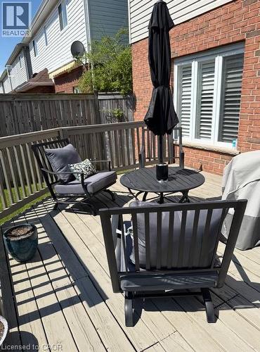 Hardwood deck featuring wood railing and privacy fencing - 5383 Haldimand Crescent, Burlington, ON 