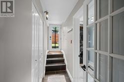 Hallway to backyard w utility closet. - 