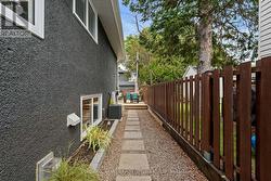 Landscaped access from right side of the home. - 
