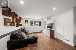 Bright windows and hardwood floors throughout! - 