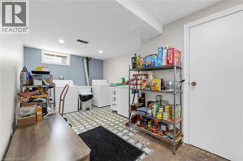 The property features a dedicated laundry area with a washer and dryer, set on a tiled floor - 7506 Jubilee Drive, Niagara Falls, ON 