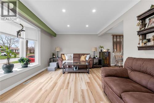 The living area features light-toned flooring, recessed lighting, and a bay window providing natural light - 7506 Jubilee Drive, Niagara Falls, ON 