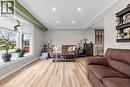 The living area features light-toned flooring, recessed lighting, and a bay window providing natural light - 7506 Jubilee Drive, Niagara Falls, ON 