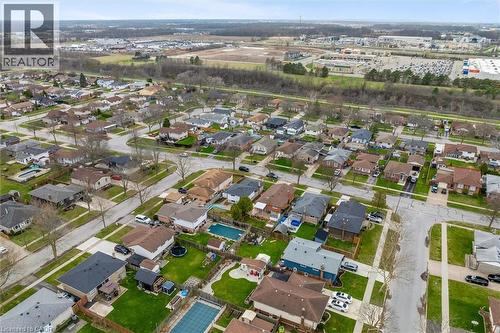 This aerial perspective showcases a residential neighborhood with detached properties and paved streets - 7506 Jubilee Drive, Niagara Falls, ON 