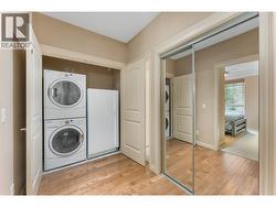 Stacked in-unit laundry plus an included upright freezer. - 