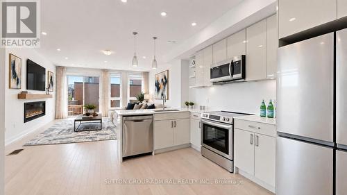 Virtually Staged - Kitchen and Living Area - 1 - 70 Green Gardens Boulevard, Toronto, ON 