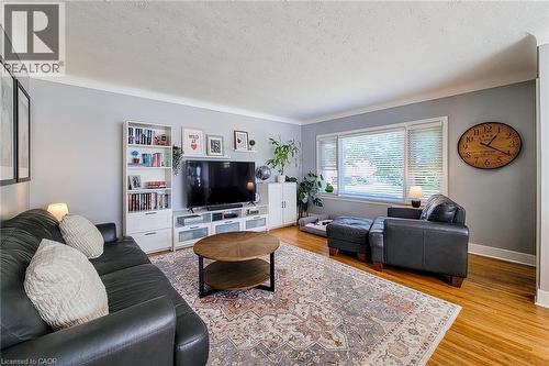 Hardwood flooring, crown molding, white trim, and built-in shelving - 19 Thorndale Avenue, St. Catharines, ON 