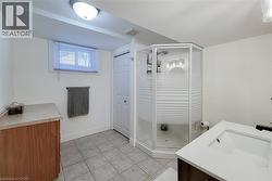 White-finish vanity with an integrated sink and dark-finish faucet - 