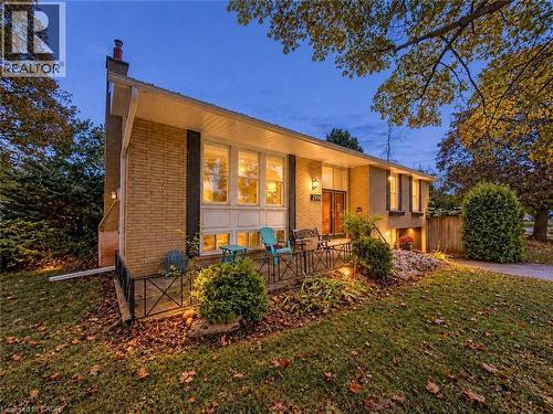 Brick exterior with a prominent chimney and white eaves - 2490 Yarmouth Crescent, Oakville, ON 