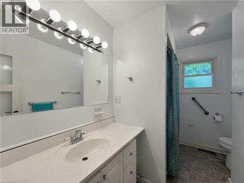 Vanity with integrated sink, chrome faucet, and overhead lighting - 2490 Yarmouth Crescent, Oakville, ON 