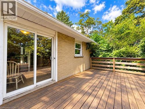 Expansive wooden deck with a slatted railing, providing an outdoor extension to the living space - 2490 Yarmouth Crescent, Oakville, ON 