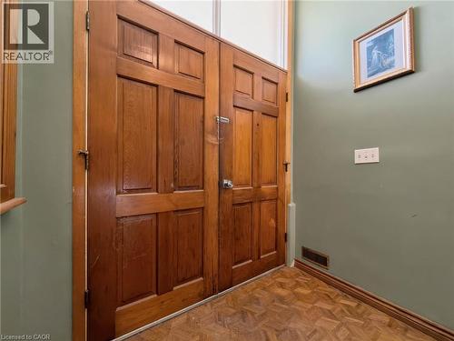 Wood-paneled double doors with a transom window - 2490 Yarmouth Crescent, Oakville, ON 
