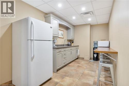 Kitchenette featuring light-toned cabinetry, light-toned countertops, and recessed lighting - 23 Market Street W, Port Dover, ON 