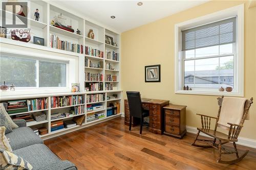 Built-in shelving, wood-finish flooring, recessed lighting, and bright windows - 23 Market Street W, Port Dover, ON 