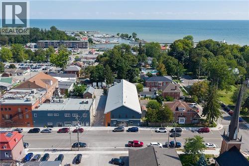 Commercial building with a prominent street-front presence and direct proximity to a body of water and marina - 23 Market Street W, Port Dover, ON 