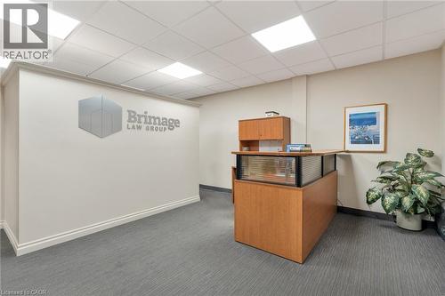 Recessed lighting, wood-finish reception desk, light-toned wall paint, drop ceiling, and gray textured carpeting - 23 Market Street W, Port Dover, ON 