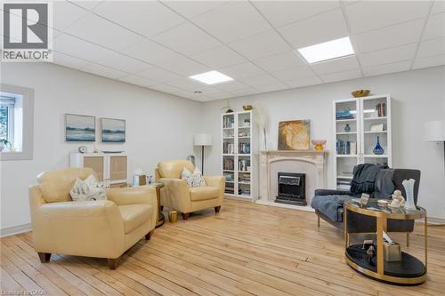 Hardwood flooring, recessed lighting, and a window with white trim - 23 Market Street W, Port Dover, ON 