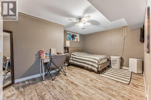 Wood-finish flooring, neutral wall tones, recessed ceiling, and a ceiling fan - 423 Poldon Drive, Norwich, ON 