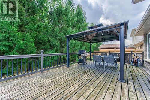 Expansive wood deck with dark railings - 423 Poldon Drive, Norwich, ON 