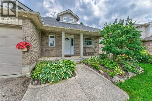 Brick facade with an integrated garage door - 423 Poldon Drive, Norwich, ON 