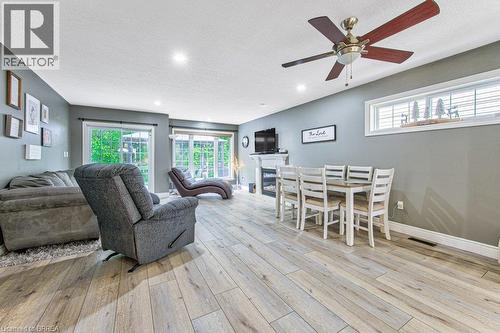 Wood-finish flooring, recessed lighting, and a ceiling fan with integrated light - 423 Poldon Drive, Norwich, ON 