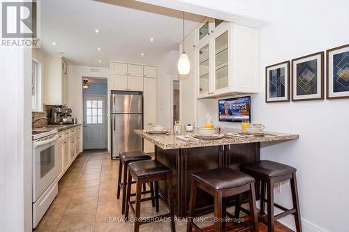 Kitchen with Granite Breakfast BAr - 19 Strathgowan Crescent, Toronto, ON 