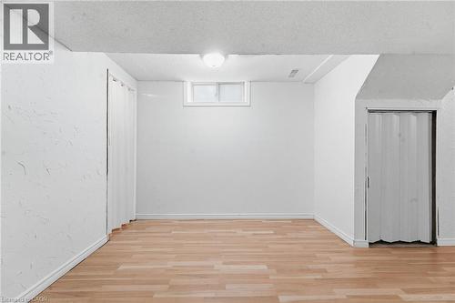 Wood-finish flooring, white walls, and a ceiling-mounted light fixture - 449 Exmoor Street, Waterloo, ON 