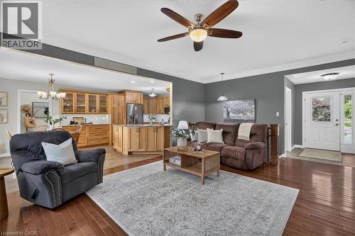 Hardwood-finish flooring, recessed lighting, and a ceiling fan with integrated lighting - 515 Woodward Drive, Mount Brydges, ON 